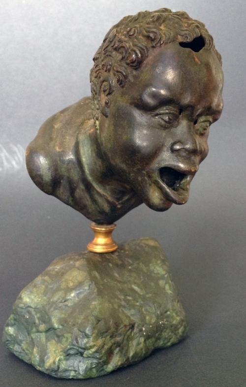 A Renaissance Bronze Oil Lamp after a Roman Head of a Nubian